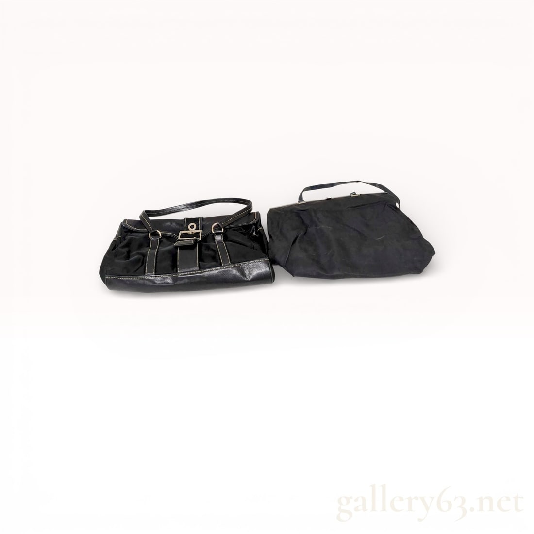 Prada Black Nylon Shoulder Bags, Set of Two: Set of two Authentic Prada shoulder bags, each having a black nylon exterior with silver-tone hardware. One bag featuring buckle strap details and leather trim along the base and corners, with a zip-t
