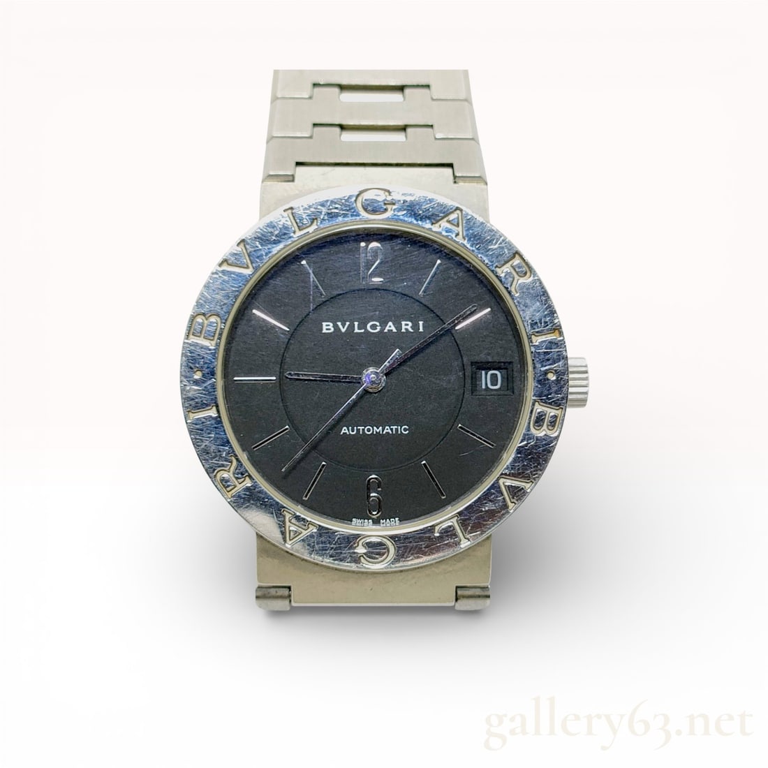 BVLGARI Stainless Steel Automatic Watch 32mm:  authentic bvlgari men’s watch featuring the signature “bvlgari bvlgari” engraved bezel and a sleek black dial with minimalist stick hour markers. automatic movement ensures smooth, rel