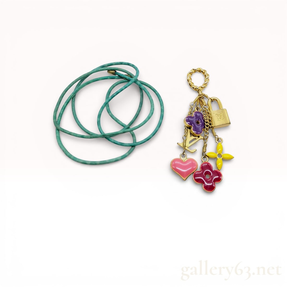 Louis Vuitton Sweet Monogram Charm Pendant Choker Necklace with Green Cord with Box & Pouch: Louis Vuitton Sweet Monogram choker necklace featuring a green leather cord and gold-tone charm pendant cluster. Designed with signature LV motifs including a padlock, LV initials, and enamel monogram