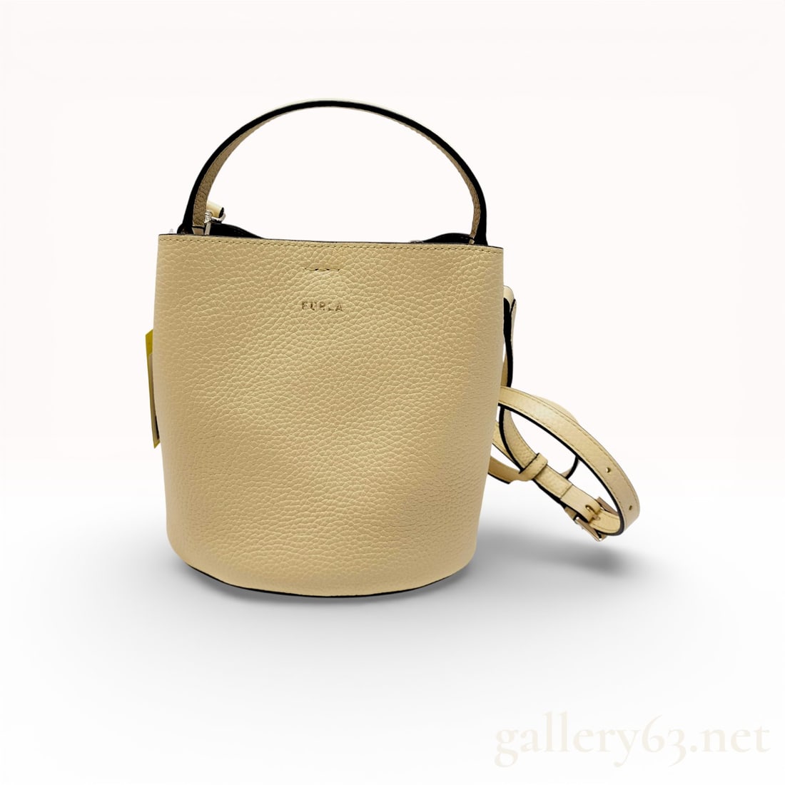 Furla Danae 2-Way Cream Pebbled Leather Bucket Bag with Top Handle and Shoulder Strap: Furla Danae 2-way handbag crafted in cream pebbled leather featuring a structured bucket silhouette. Designed with a single top handle and detachable adjustable shoulder strap for crossbody or
