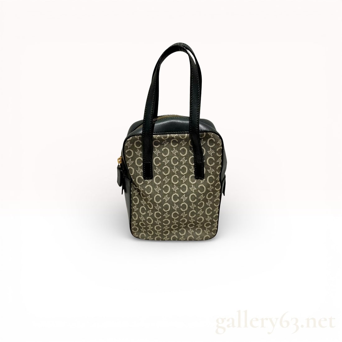 Vintage Celine C Macadam Canvas Handbag: Authentic Céline vintage handbag in brown C Macadam canvas featuring the repeating monogram pattern throughout. The structured compact silhouette is trimmed in black leather with dual flat top
