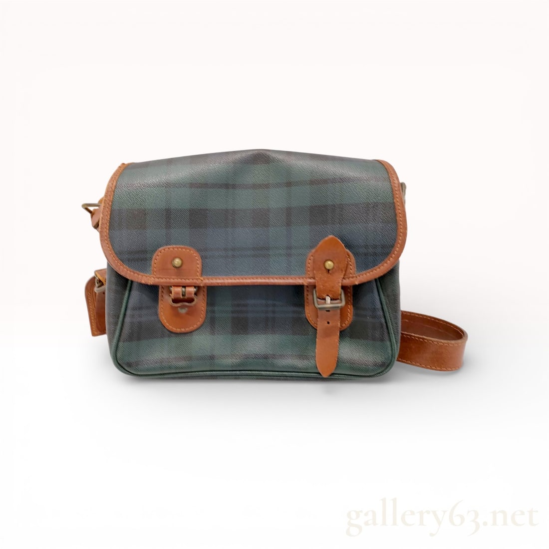 Polo Ralph Lauren Messenger PVC Bag: Authentic Polo Ralph Lauren messenger bag in green plaid with brown leather trim. The bag features a flap-front design secured with dual leather strap and buckle closures, accented with gold-tone