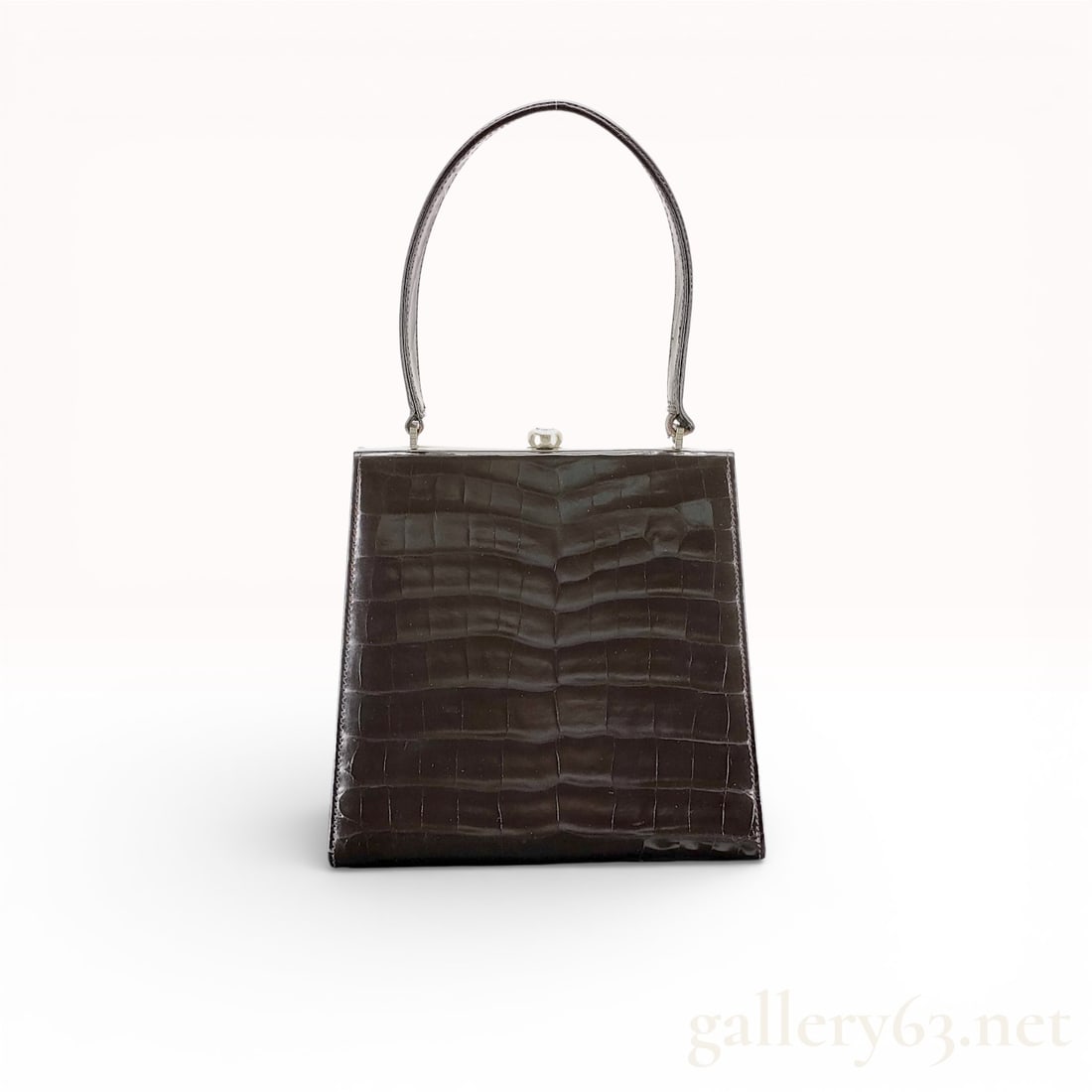 Versace Crocodile Leather Handbag with Dust Bag: Authentic Versace handbag in dark brown crocodile leather, featuring a structured rectangular silhouette with a rigid top frame and snap clasp closure. The exterior presents a glossy