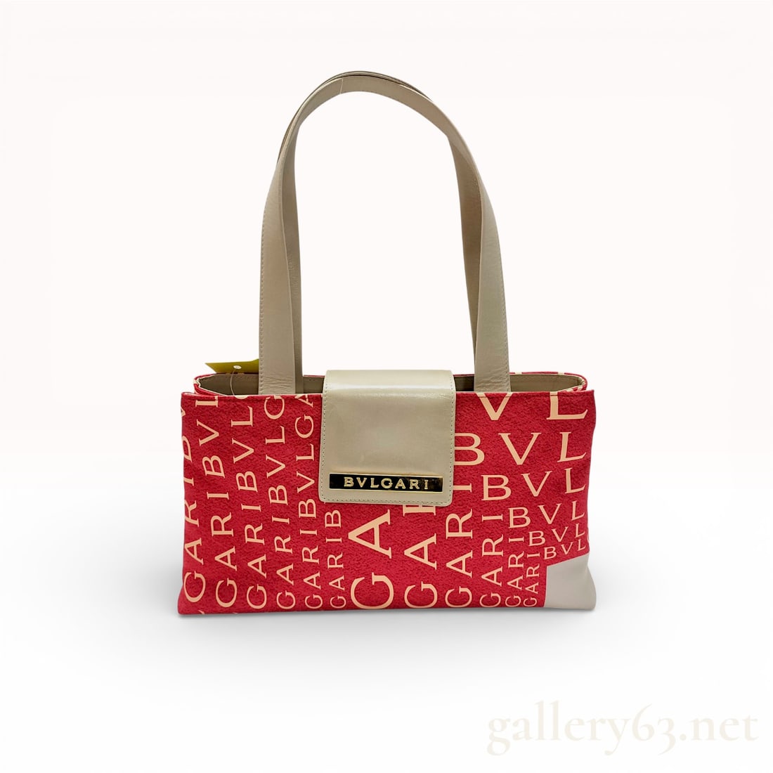 Bvlgari Logomania Red Canvas Handbag with Cream Leather Trim and Logo Plaque: Bvlgari Logomania handbag crafted in red canvas featuring an allover BVLGARI logo print. Designed with cream leather trim, dual shoulder handles, and a structured open-top silhouette. Finished with a