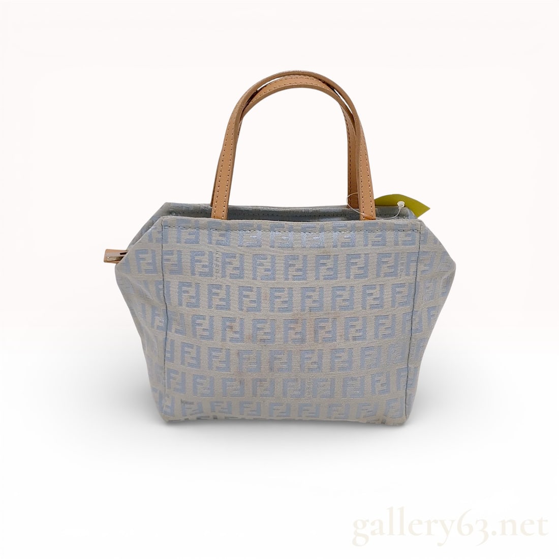 Fendi Zucchino Canvas Tote Bag: Authentic Fendi Zucchino tote bag in light blue canvas featuring the tonal FF monogram pattern throughout. The structured silhouette includes natural leather top handles and matching trim. Soft palett