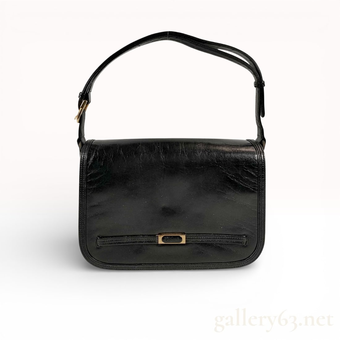 Chloe One-Shoulder Bag: Authentic Chloé one-shoulder bag in black leather, featuring a structured rectangular silhouette with softly rounded corners. The flap front is detailed with a horizontal zip pocket and gold tone acc