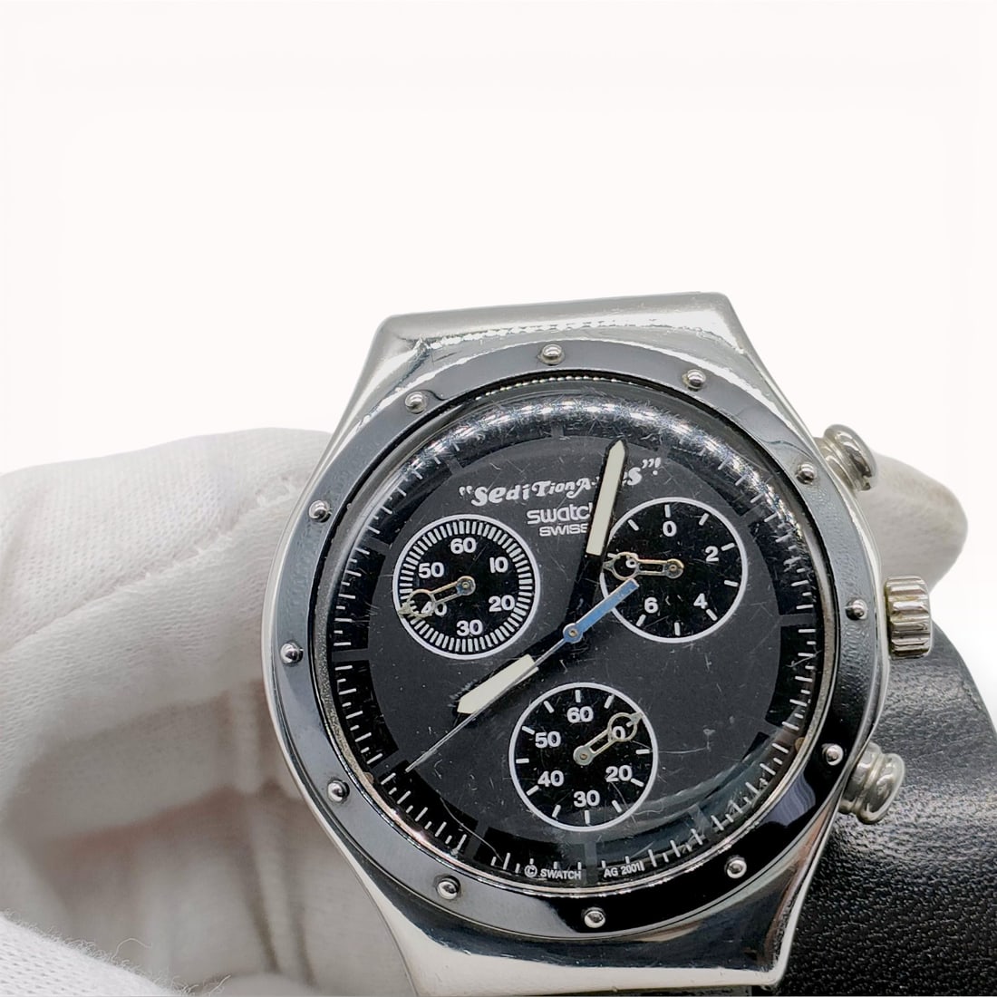 Swatch x Vivienne Westwood Seditionaries Watch: Authentic Swatch x Vivienne Westwood chronograph wristwatch from the “Seditionaries” collaboration, AG 2001. The watch features a round silver-tone case with exposed screw accents and a black