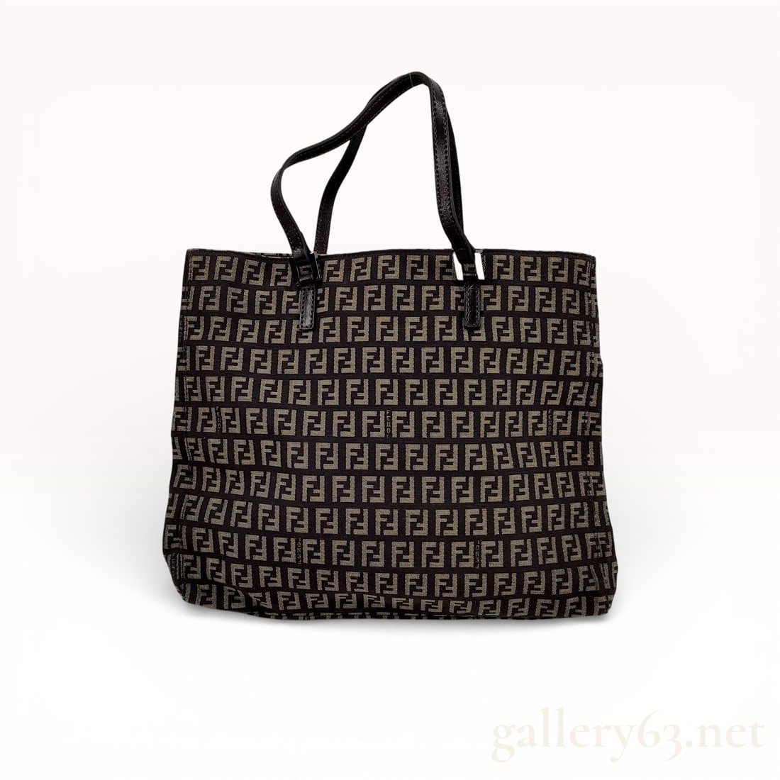 Fendi Zucchino Canvas Tote Bag: Authentic Fendi Zucchino tote bag in brown canvas featuring the repeating FF monogram pattern throughout. The soft rectangular silhouette is trimmed in dark leather with dual flat shoulder straps. Sig