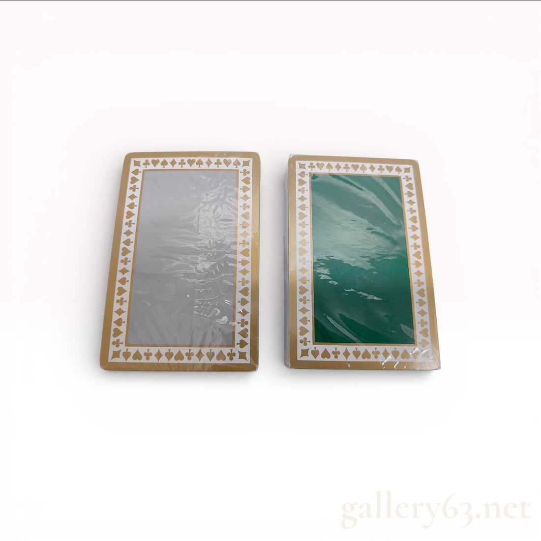 Tiffany & Co. Playing Cards Set in Tiffany Blue Box - Brand New: Tiffany & Co. playing cards set featuring two full decks. Cards having white backs with gold-tone borders and suit motifs framing a central panel in silver and green.