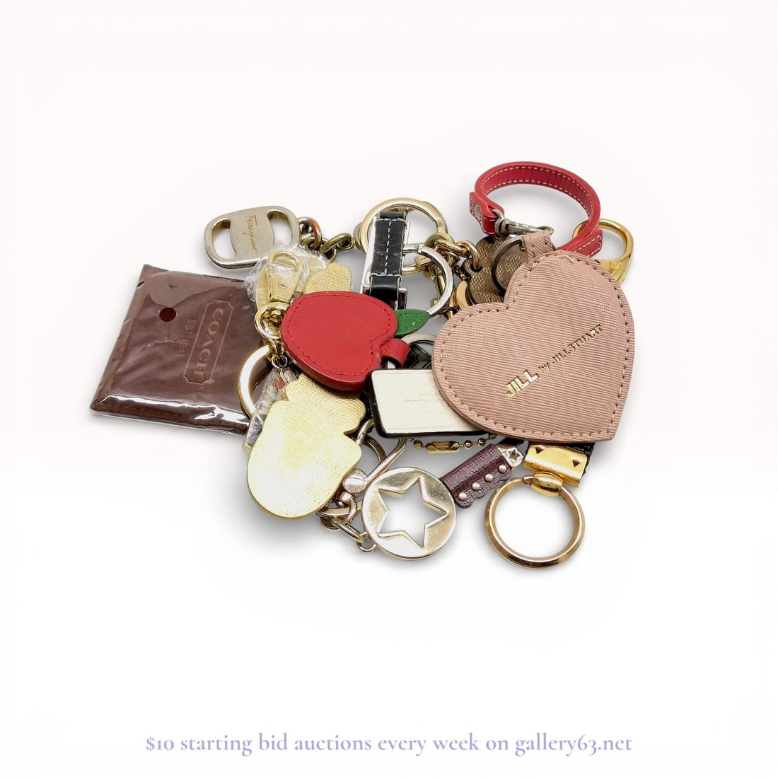 Coach, Furla, Ferragamo, etc. Designer Accessories /Keychains Group Lot: Estate lot offered as shown, including all items visible in the images. Offered as a single lot with no individual examination; contents and condition vary and may include wear, damage, or missing ele