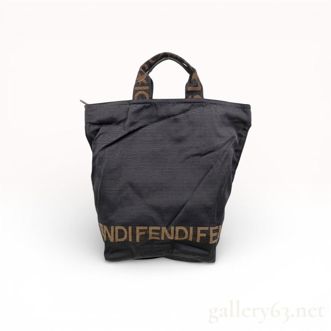 Fendi Black Nylon Canvas Shopper Tote Bag: Authentic Fendi shopper tote bag in black nylon canvas, featuring a lightweight soft silhouette with wide base. The design includes dual short top handles woven with Fendi logo detailing and coordinat