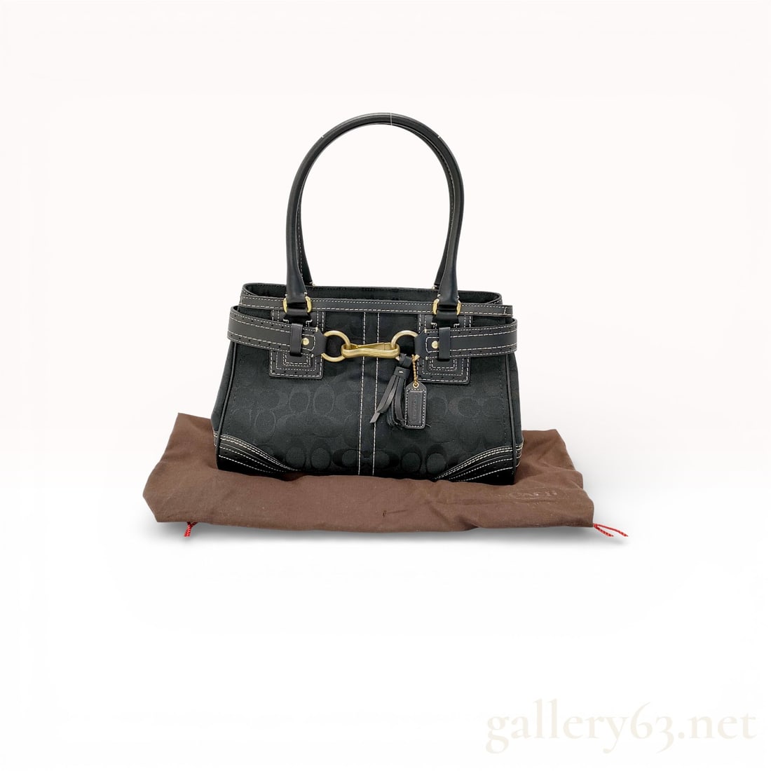 Coach Signature 10507 Black Canvas and Leather Satchel Handbag with Horsebit Hardware: Coach Signature satchel style 10507 crafted in black signature canvas with black leather trim. Designed with dual rolled top handles, contrast stitching, and gold-tone horsebit hardware at front. Stru