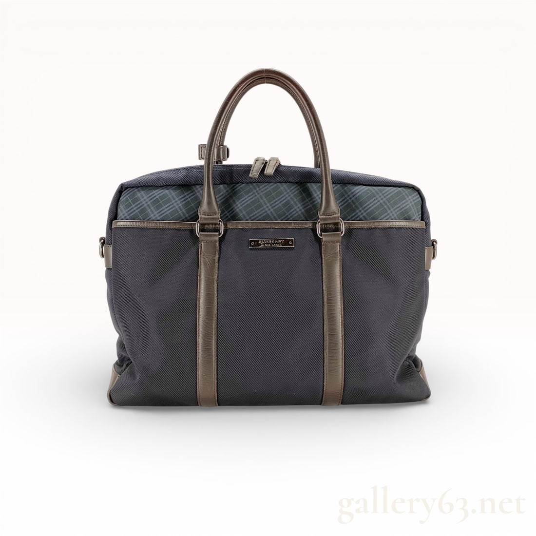 Burberry Black Label Business Bag: Authentic Burberry Black Label business bag in navy blue nylon with brown leather trim. The bag features a structured rectangular silhouette with dual rolled leather top handles and a top zip closure.