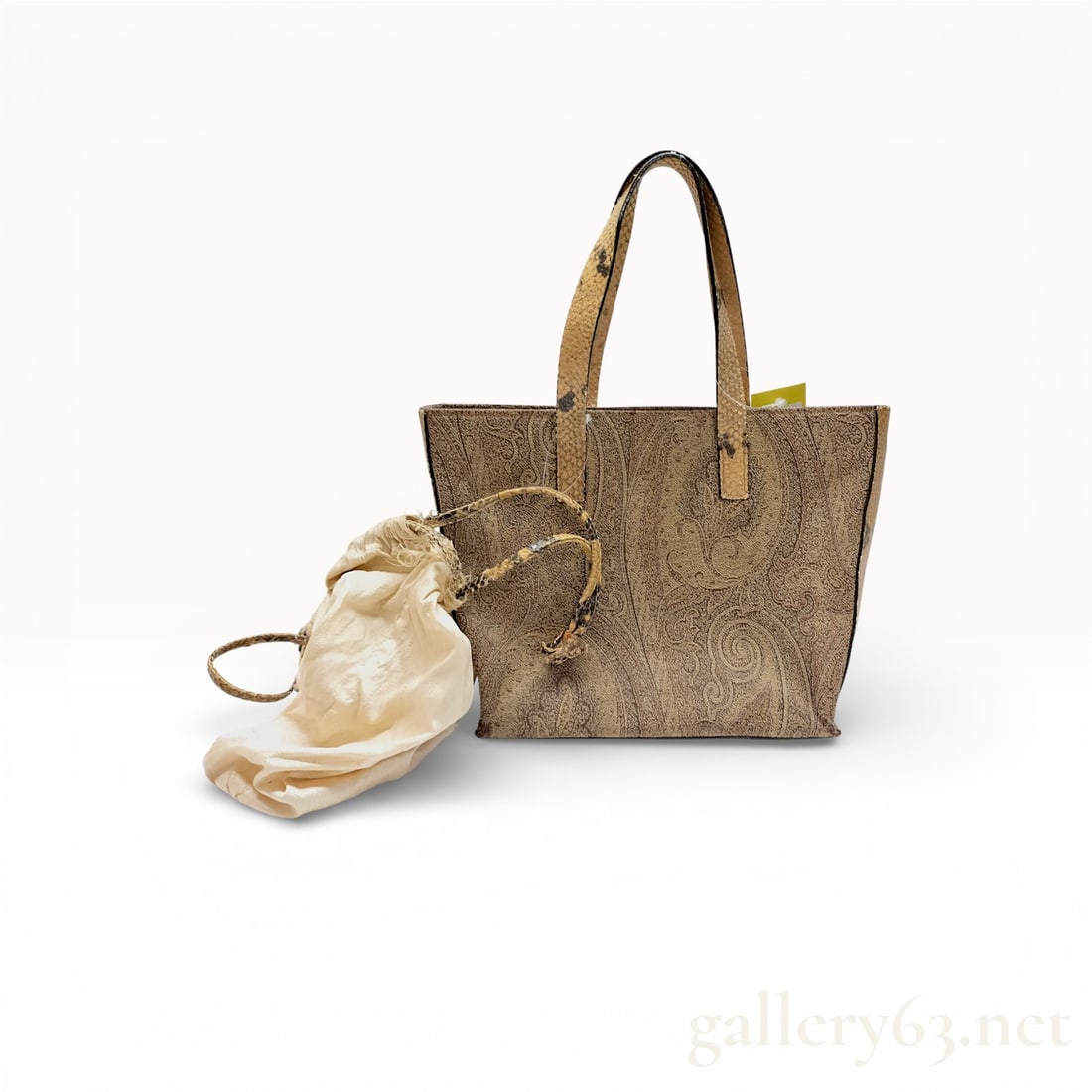 Etro Mini Paisley Tote Bag with Drawstring Pouch and Snakeskin-Style Trim: Etro mini tote bag featuring the brand’s signature paisley pattern in neutral tones. Designed with dual top handles and a structured open-top silhouette. Includes a coordinating drawstring pouch ins