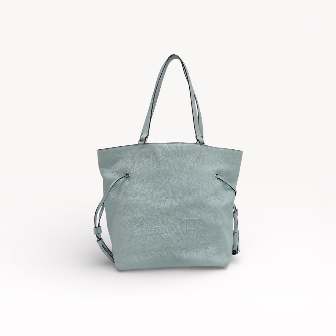 Coach Andy Tote with Horse and Carriage Medallion in Pale Blue Pebble Leather: Authentic Coach Andy tote in pale blue pebble leather. The design features dual flat shoulder straps, a structured silhouette, and silver-tone hardware with the signature Horse and Carriage medallion