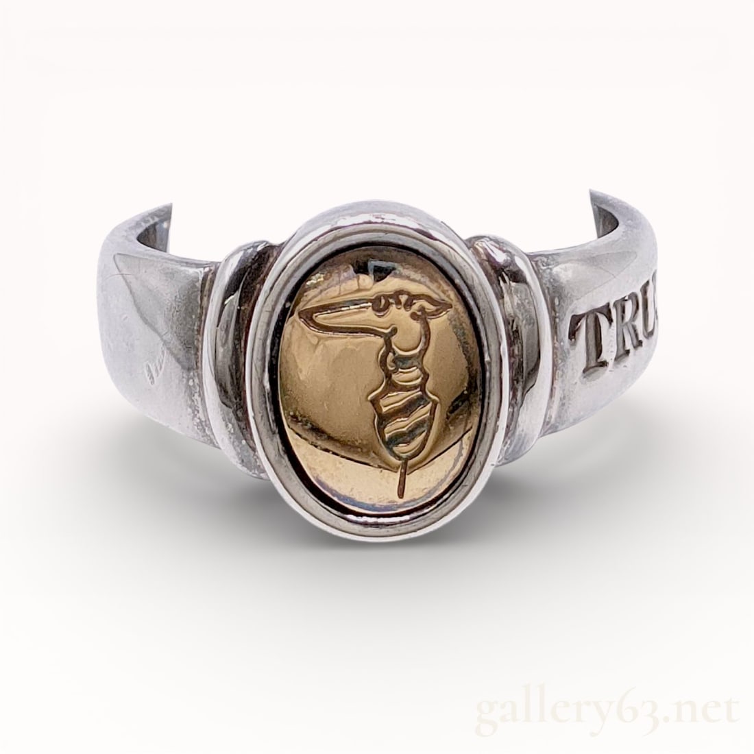 Trusaldi 18k and .925 Silver Size 6 Ring: Authentic Trusaldi ring made up of sterling silver band of size 6, featuring an oval bezel set with a gold-tone insert bearing an engraved classical profile motif. Construction presenting a raised bez