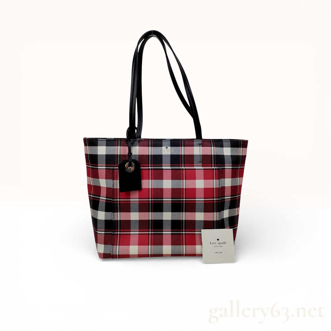 Kate Spade New York Hyde Lane Plaid Riley Small Tote: A Kate Spade New York Hyde Lane Plaid Riley small tote bag. The exterior is constructed from a textured coated canvas featuring a red, black, and white plaid pattern. The design includes dual black sh