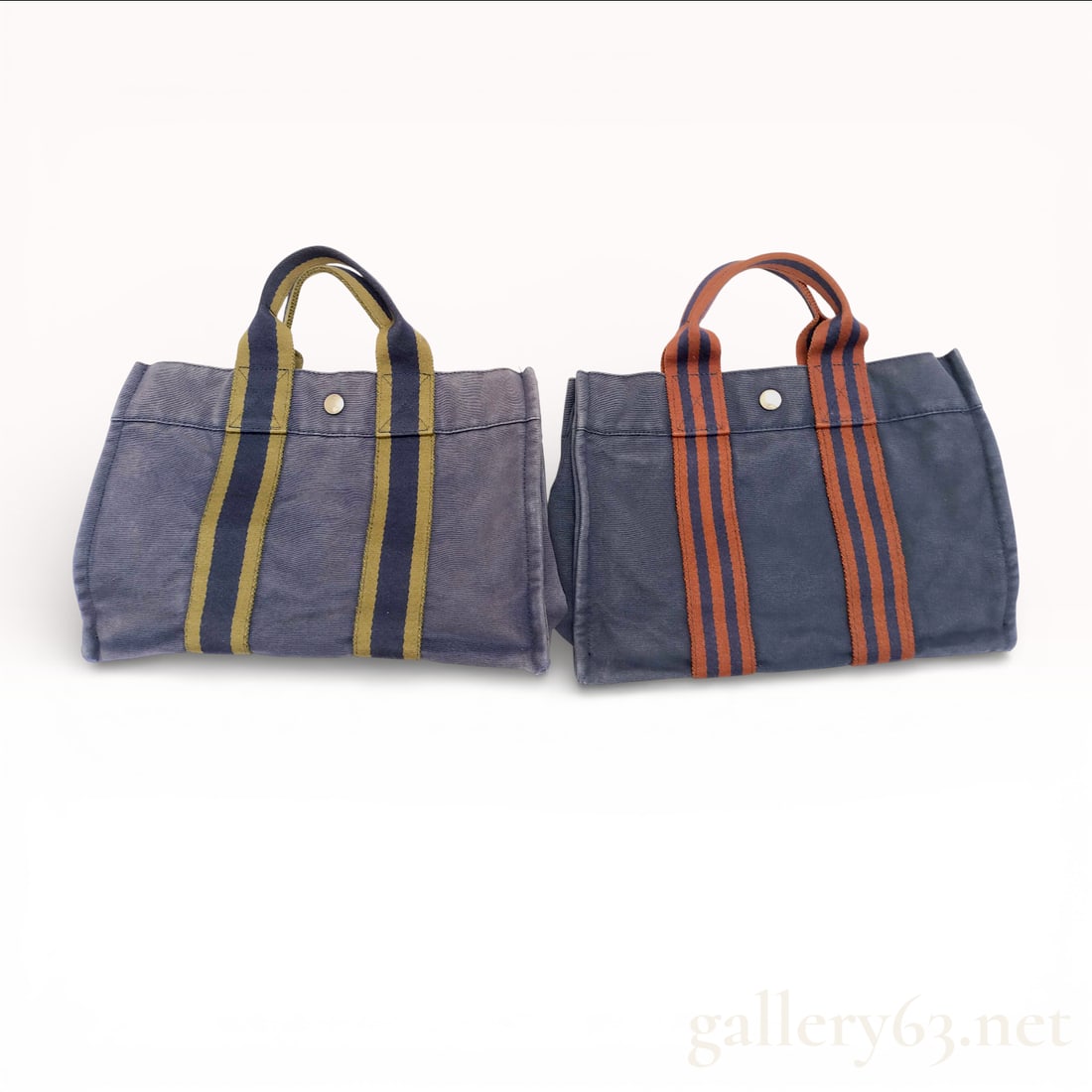 A Pair of Hermes Fourre Tout PM Cotton Canvas Tote Bags: A pair of Hermes Fourre Tout PM cotton canvas tote bags. These items are constructed from heavy-weight cotton canvas in an open-top rectangular silhouette. The design features woven webbed handles wit