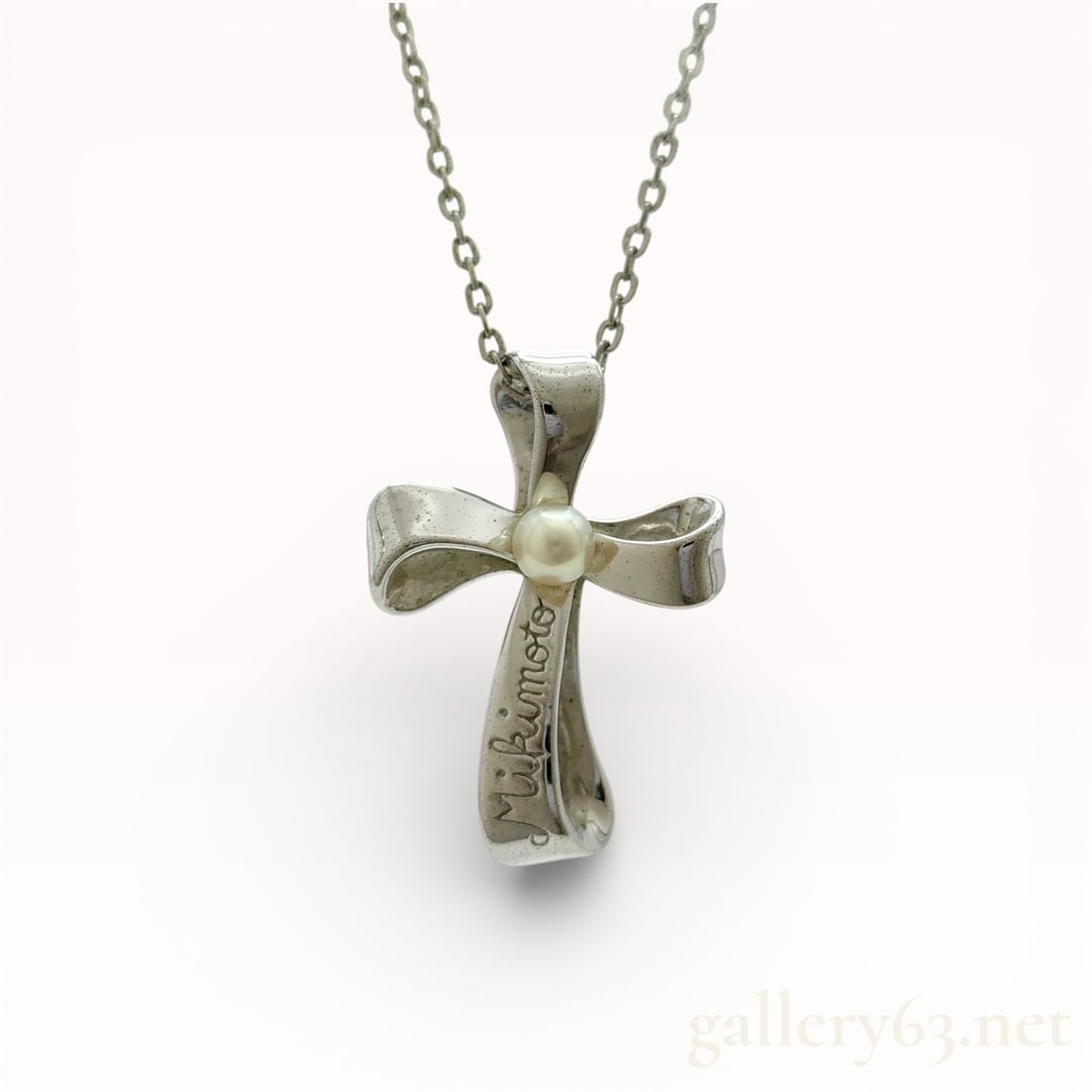 Mikimoto Sterling Silver 4.0mm Pearl Cross Pendant Necklace 16": Mikimoto sterling silver necklace featuring a fine link chain and a sculptural cross pendant. Cross formed with softly contoured arms and a polished surface, set at center with a single round cultured