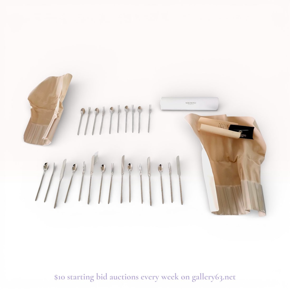 A Collection of Mikimoto International 18-8 Stainless Steel Cutlery: A collection of Mikimoto International cutlery featuring a modern, minimalist design. Each piece is crafted from 18-8 stainless steel and is marked with a crown and shell motif. The lot includes an as