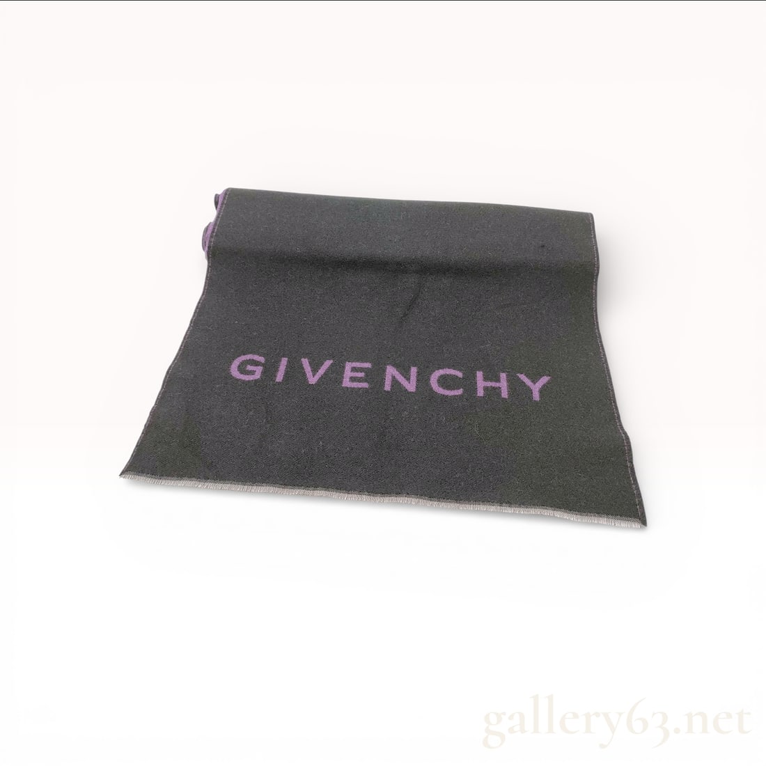 Givenchy Scarf, Reversible Wool and Silk Logo: Givenchy scarf made of 82% wool, 9% virgin wool, and 9% silk. Features a reversible bi-color design with one side in charcoal gray featuring a purple GIVENCHY block letter logo and the reverse side in