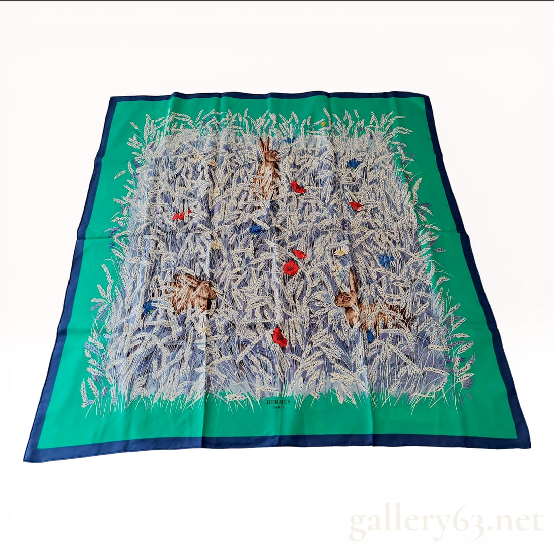 Hermes Paris Carre 90 Silk Scarf Lapins Dans Un Champ De Ble: This authentic Hermes Paris square silk scarf, known as the Carre 90, features the Lapins Dans Un Champ De Ble (Rabbits in a Wheat Field) pattern designed by Hubert de Watrigant. Crafted from 100% sil