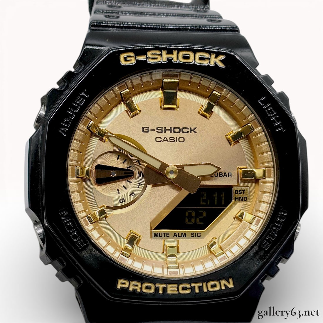 Casio G-Shock GA-2100GB-1A Black and Gold Analog-Digital Watch: Casio G-Shock, model GA-2100GB-1A, reference module 5611. Quartz movement. Black resin case featuring Carbon Core Guard structure. Gold-toned analog-digital dial with gold-toned hands and indices. Int