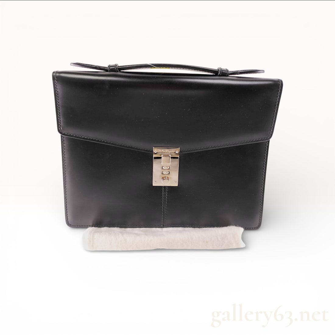 Salvatore Ferragamo Slim Portfolio Briefcase, Polished Calfskin Leather, Black: This Salvatore Ferragamo slim portfolio briefcase is crafted from high-quality, smooth black calfskin leather with a polished finish. It features a structured silhouette with a single flat leather top