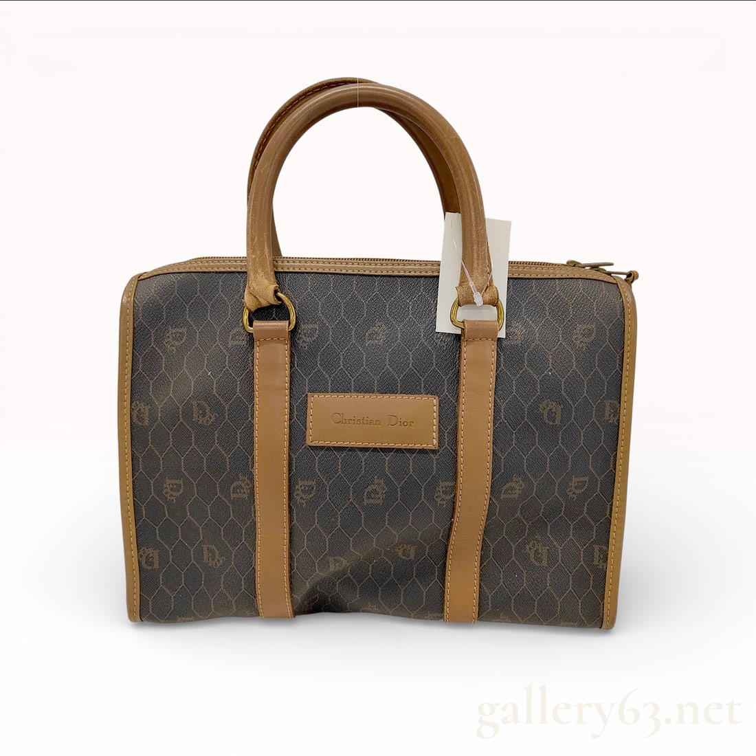 Christian Dior Vintage Honeycomb Monogram Boston Bag Coated Canvas Black: This vintage Christian Dior Boston bag is crafted from durable coated canvas featuring the house signature honeycomb monogram pattern in a black and dark gray color palette. The bag is accented with t