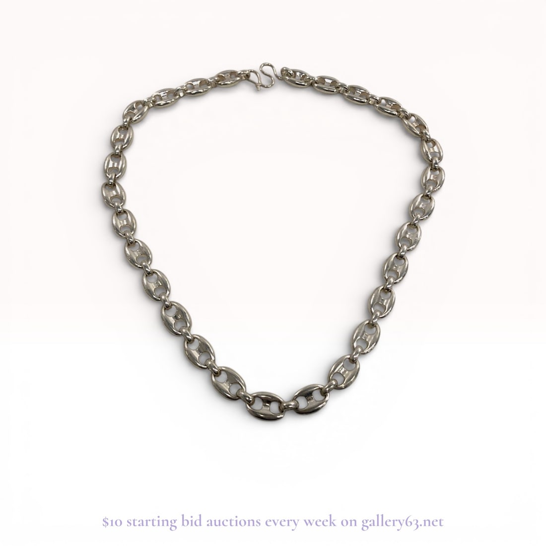 Sterling Silver Heavy Puffed Mariner Link Necklace: This is a substantial sterling silver chain necklace featuring a heavy puffed mariner link design, also referred to as an anchor or Gucci link. The piece is crafted from .925 purity silver and is secu