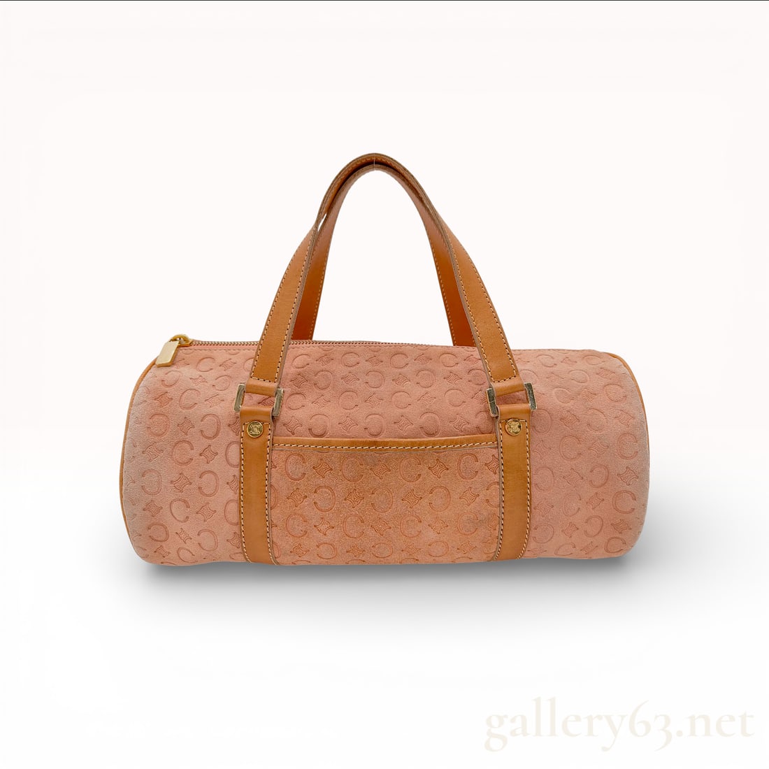 Celine Vintage Macadam Embossed Suede Barrel Bag Dusty Rose: This vintage Celine barrel bag features a dusty rose suede body with an all-over embossed Macadam monogram pattern. The cylindrical silhouette is accented by smooth tan leather trim and dual flat top