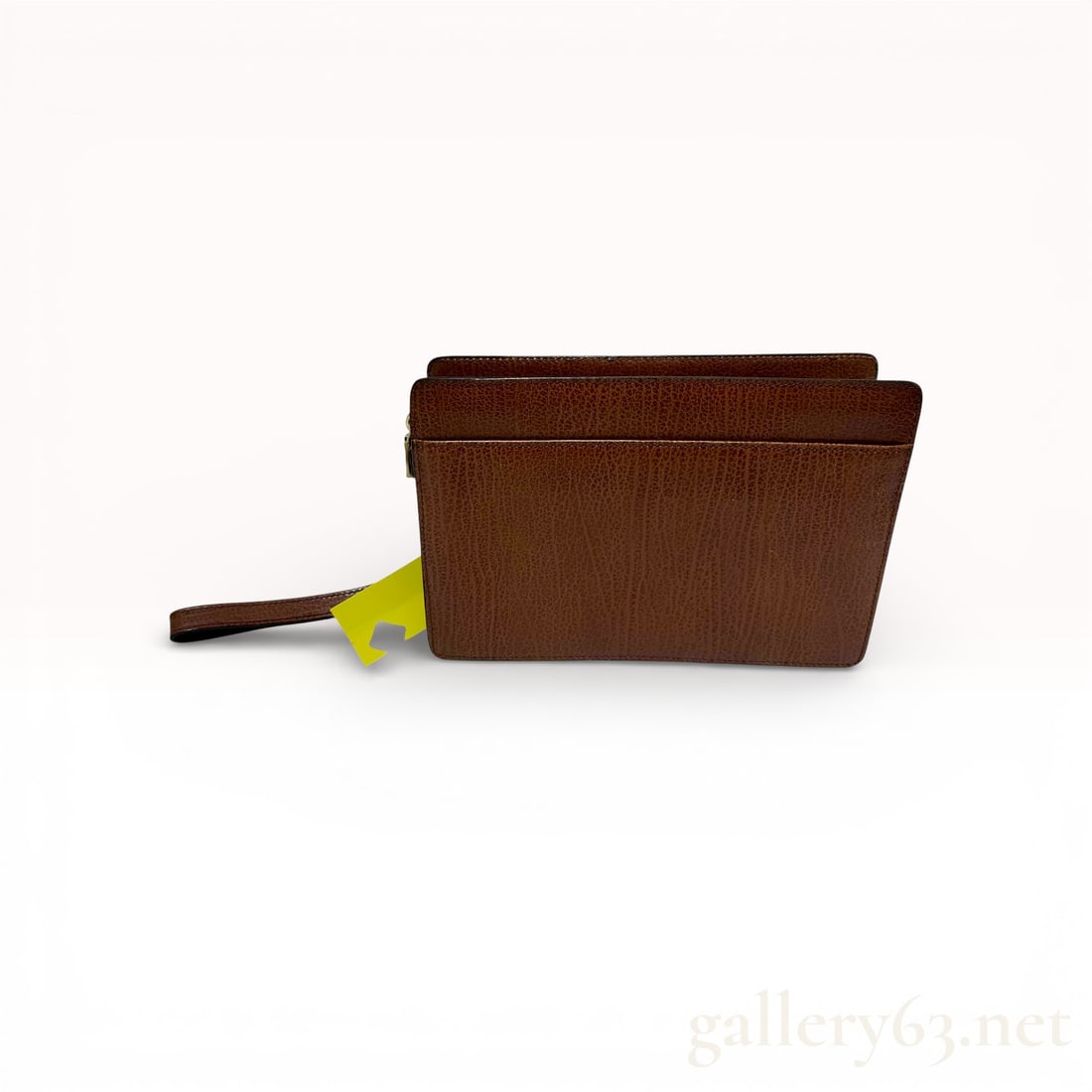 Bally Vintage Grained Leather Wristlet Clutch, Chestnut Brown: This vintage Bally wristlet clutch is crafted from rich chestnut brown grained calfskin leather. The rectangular silhouette features a textured pebble finish and a detachable leather wrist strap secur