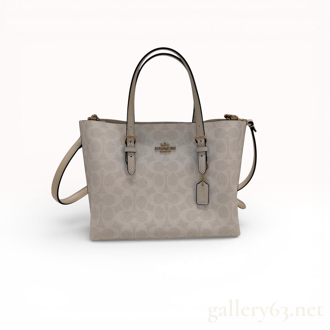 Coach Mollie Tote 25 in Signature Coated Canvas and Leather, Chalk: This Coach Mollie Tote 25 is crafted from signature tonal monogram coated canvas with chalk-colored smooth leather trim and polished light gold-tone hardware. The exterior features the iconic Coach Ho