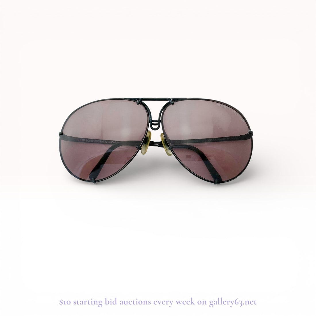 Vintage Porsche Design by Carrera 5623 Aviator Sunglasses: A pair of vintage Porsche Design by Carrera aviator-style sunglasses, model 5623. The frame is constructed of black-coated metal and holds two large tinted lenses. The right interior temple is marked