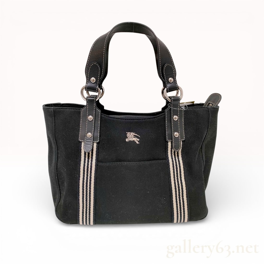 Burberry Blue Label Striped Canvas Tote Bag Black: This Burberry Blue Label tote is constructed from a durable black canvas body accented by vertical striped webbing on the front and back. The design includes black leather handles and trim featuring h