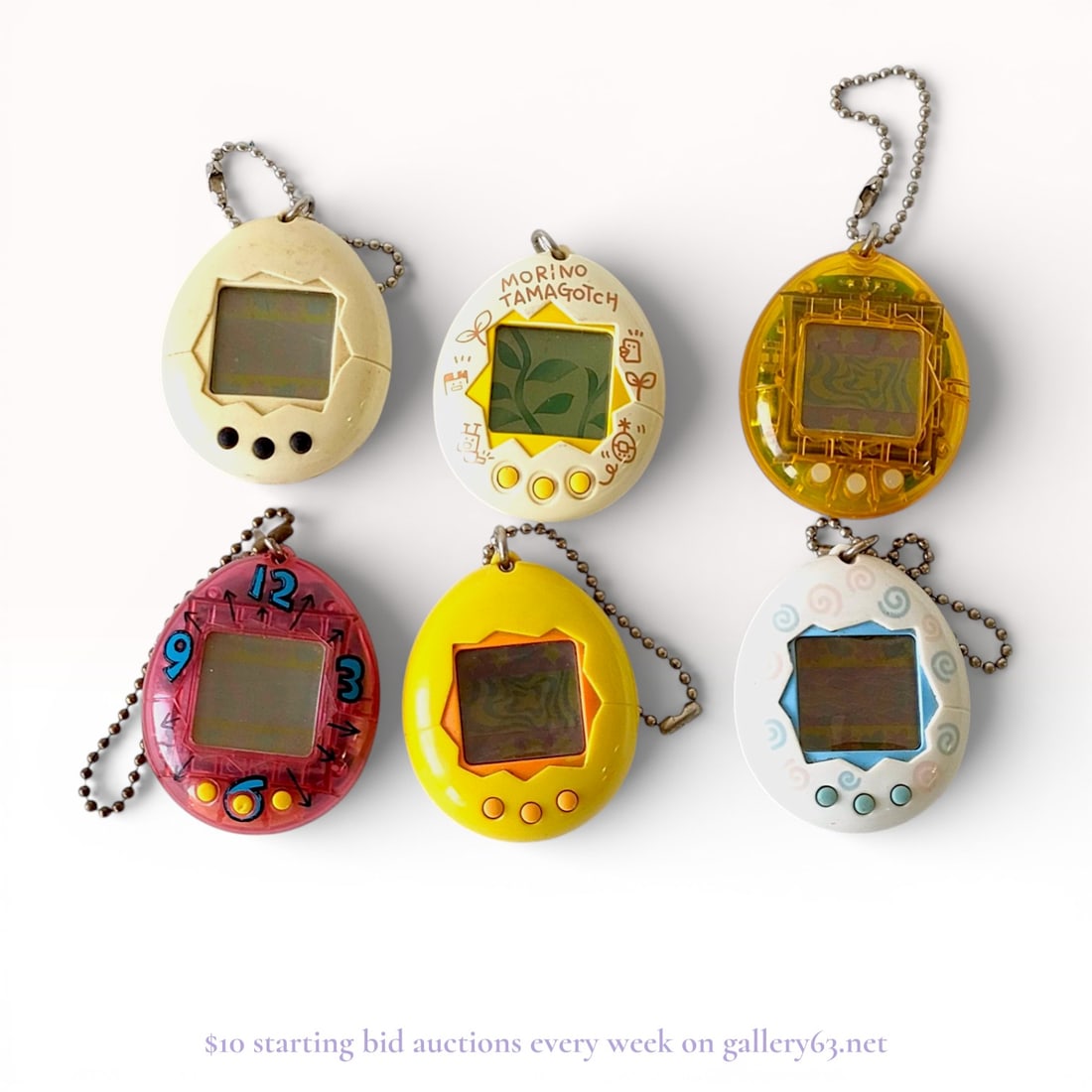 Bandai Tamagotchi Digital Virtual Pets, 1990s Era.: Manufactured by Bandai, this is a collection of six handheld digital virtual pets from the original 1990s product line. The units are constructed of molded plastic shells and feature the signature thr