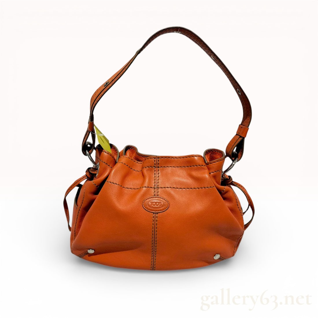 Tod's Miky Mini Grained Leather Bucket Hobo Bag, Orange: This Tod's Miky bag is crafted from vibrant orange grained leather featuring tonal contrast topstitching. The design is characterized by a slouchy, gathered silhouette with side drawstring ties and a
