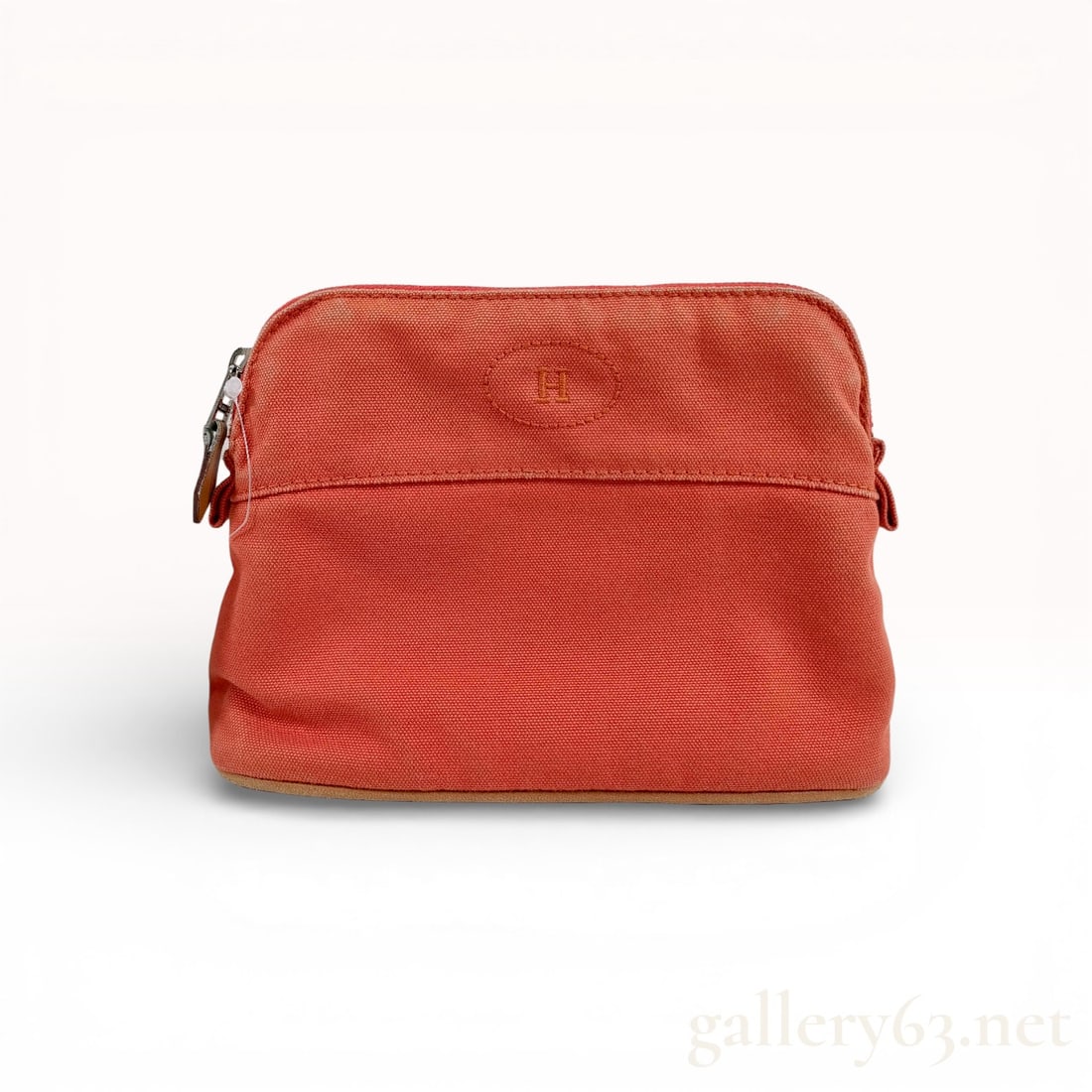 Hermes Bolide Travel Pouch Cotton Canvas Orange: This Hermes Bolide travel pouch is crafted from durable orange cotton canvas in the brand's signature Feu colorway. The front face features the iconic embroidered H logo within an oval. The design is