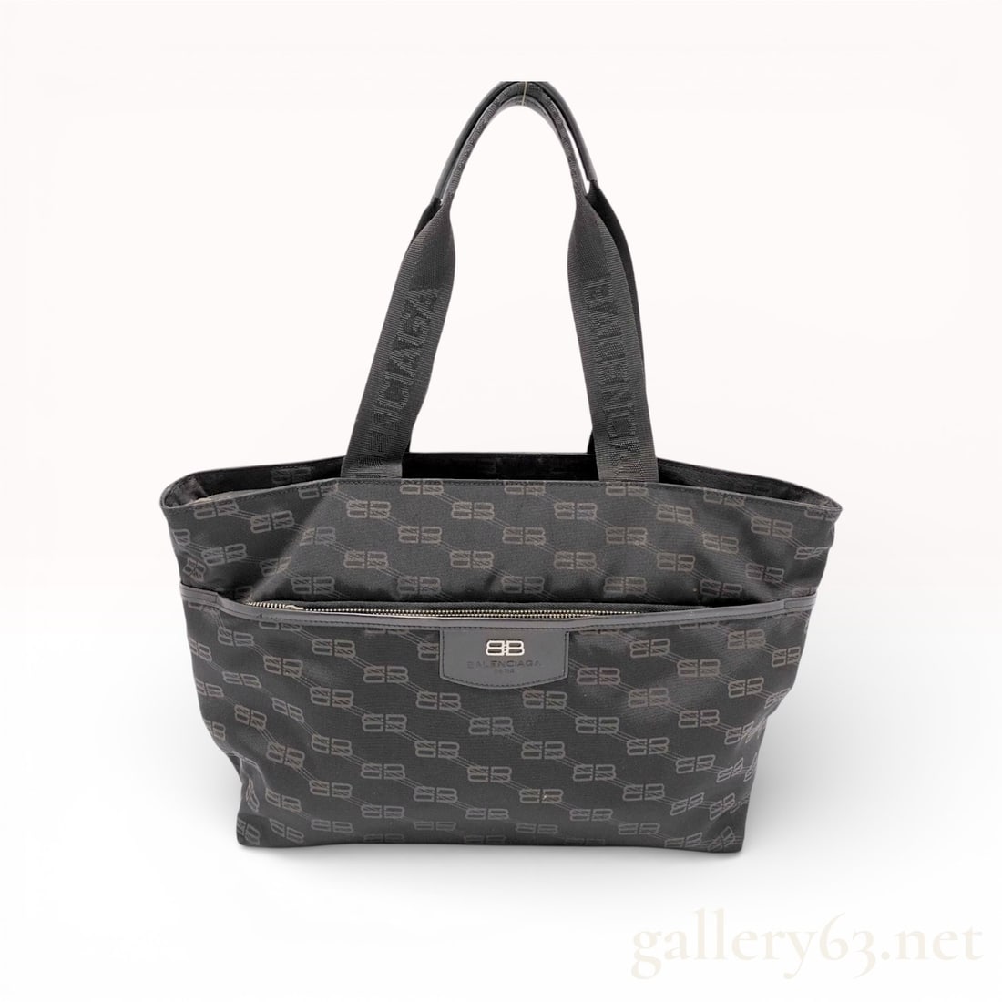 Balenciaga BB Monogram East West Tote Bag Jacquard Canvas Black: This Balenciaga East West tote bag is constructed from black jacquard nylon canvas with an all-over charcoal grey BB monogram pattern. The design features two flat jacquard woven shoulder straps with