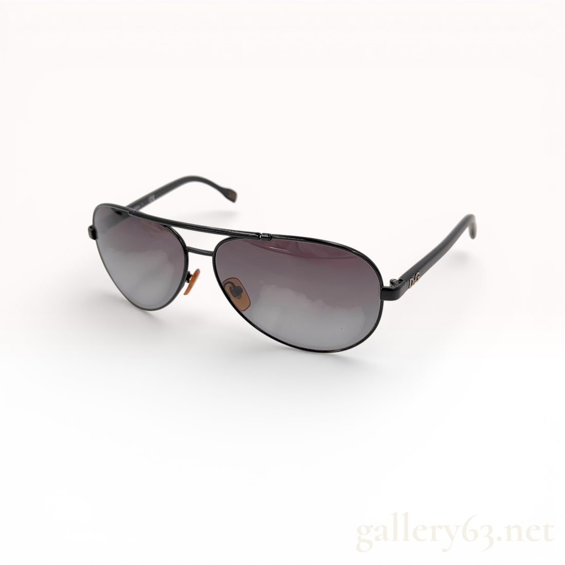 D&G Dolce & Gabbana Aviator Sunglasses, Black Metal and Acetate: A pair of D&G Dolce & Gabbana aviator-style sunglasses, model 6078. This designer eyewear features a black metal frame with a classic double bridge and black acetate temple arms. The lenses ar