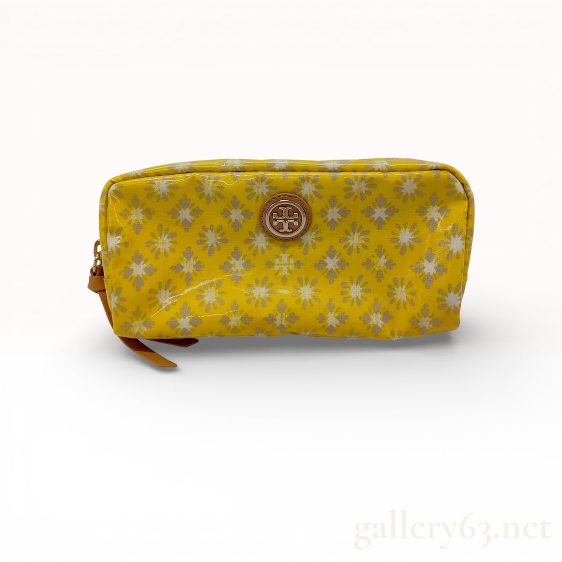 Tory Burch Printed Coated Canvas Cosmetic Case, Yellow Floral: This Tory Burch cosmetic pouch is constructed from durable coated canvas featuring a vibrant yellow background with a repeating grey and white floral medallion motif. The exterior is accented with a s