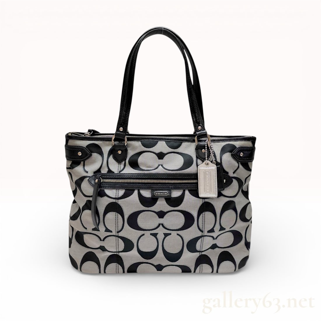 Coach Park Signature Metallic Canvas Tote, Black and Silver: This Coach Park Signature tote is crafted from metallic silver and black Optic C signature canvas with smooth black leather trim. The exterior features a front zippered pocket with a leather pull, a s