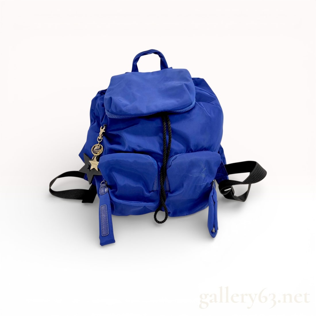 See by Chloé Joy Rider Nylon Backpack, Cobalt Blue: A See by Chloé Joy Rider backpack constructed from puffy cobalt blue nylon fabric. This lightweight bag features a drawstring closure protected by a top flap with a zippered compartment. The fr