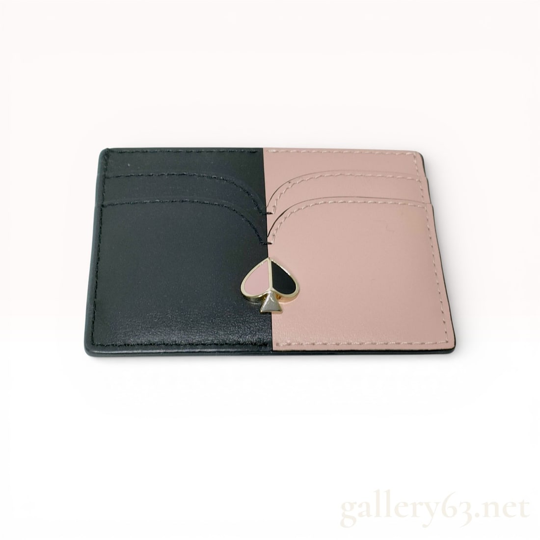 Kate Spade New York Nicola Bicolor Leather Cardholder: A professional credit card case by Kate Spade New York from the Nicola collection. This accessory features a sophisticated bicolor design in black and blush pink smooth cowhide leather. The front is a
