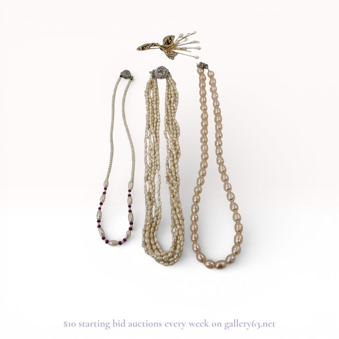 Jewelry Group Featuring Freshwater Pearl Necklaces: Silver-tone and gold-tone jewelry group including three beaded necklaces and one fashion brooch. The collection features a single-strand necklace of white baroque and oval freshwater pearls accented w