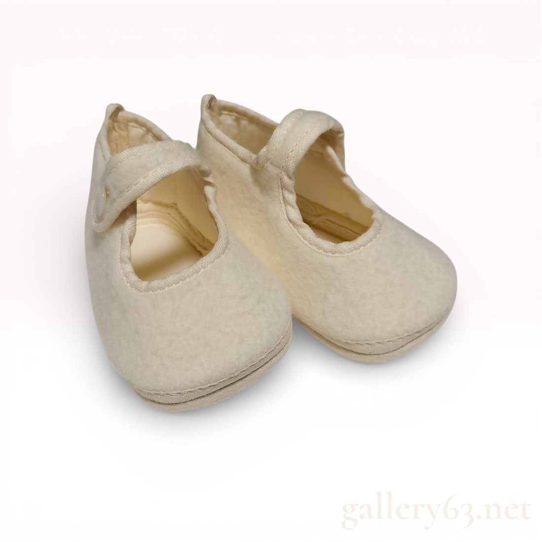 Hermes Adada Infant Mary Jane Booties, Ivory Wool and Angora: A pair of luxury infant Mary Jane-style booties featuring the signature rocking horse motif associated with the Hermes Adada nursery collection. These soft-sole shoes are crafted in France from a prem