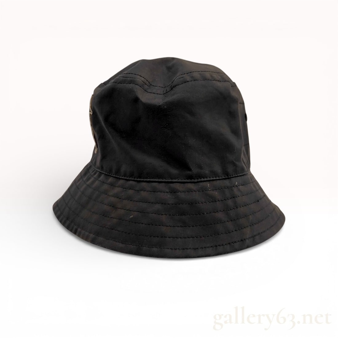Rick Owens x Champion Recycled Nylon Bucket Hat: This Rick Owens x Champion collaboration bucket hat is crafted from 100% recycled black polyamide nylon. The front is detailed with a tonal embroidered logo featuring a stylized pentagram with the Cha