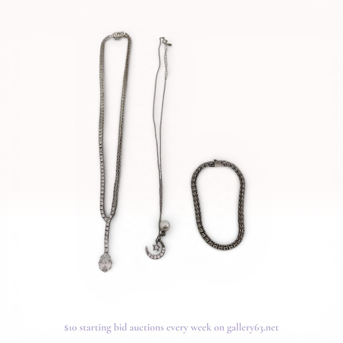 Three Sterling Silver Jewelry Pieces Including Tennis-Style Lariat Necklace and Celestial Charms: This collection features three pieces of jewelry crafted in .925 sterling silver. The first item is a tennis-style lariat necklace featuring a continuous row of round brilliant-cut clear synthetic sto