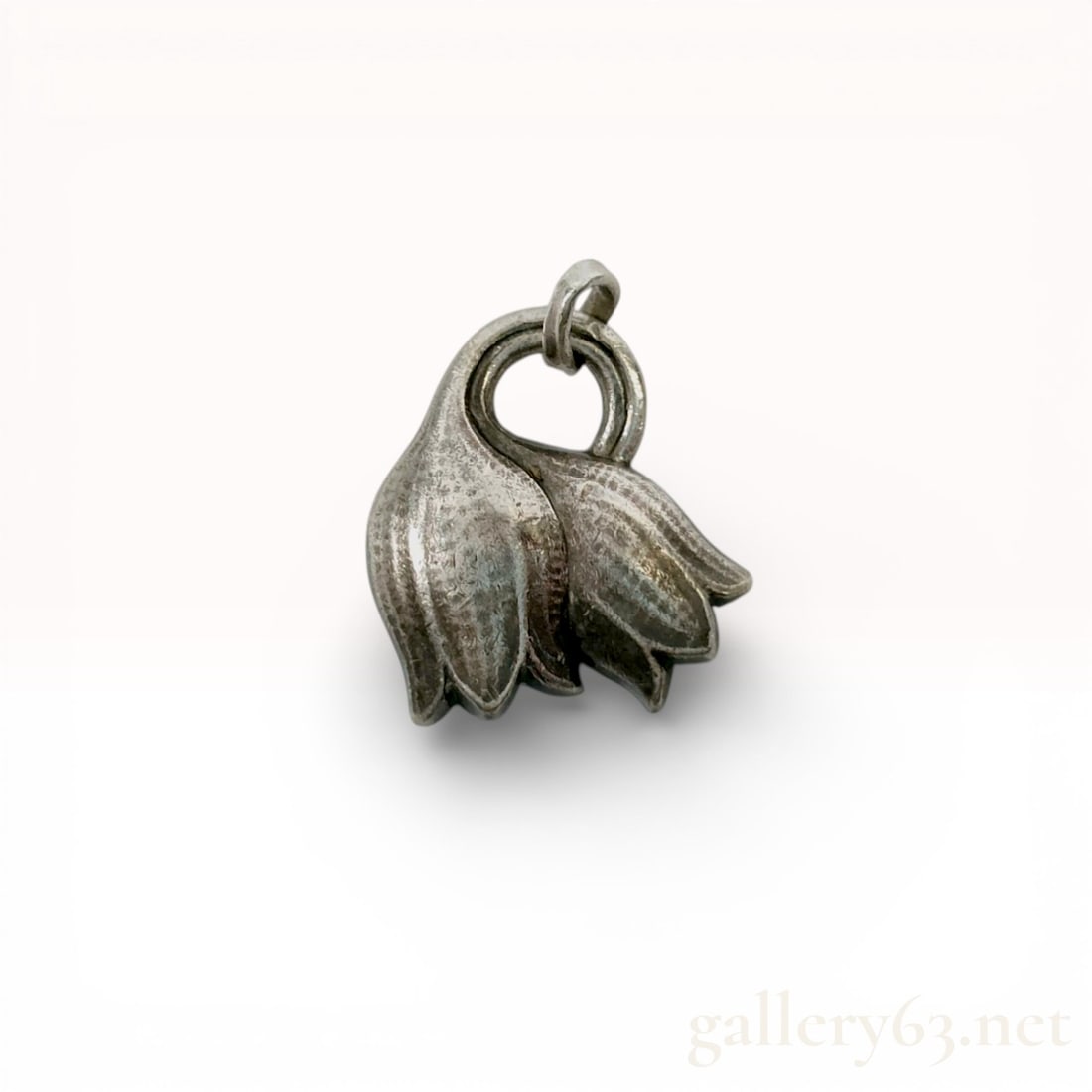 Sterling Silver Pendant, Georg Jensen Overlapping Floral Bell: This sterling silver pendant features a sculptural design of two overlapping bell-shaped flower blossoms, resembling lily of the valley or bluebells. The piece is an authentic example of Danish design