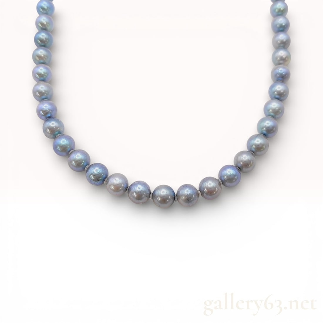 Silver Peacock Cultured Pearl Hand-Knotted Necklace: This necklace features a single strand of color-treated freshwater cultured pearls measuring approximately 7mm to 8mm. The pearls are near-round to off-round in shape and exhibit a high metallic luste